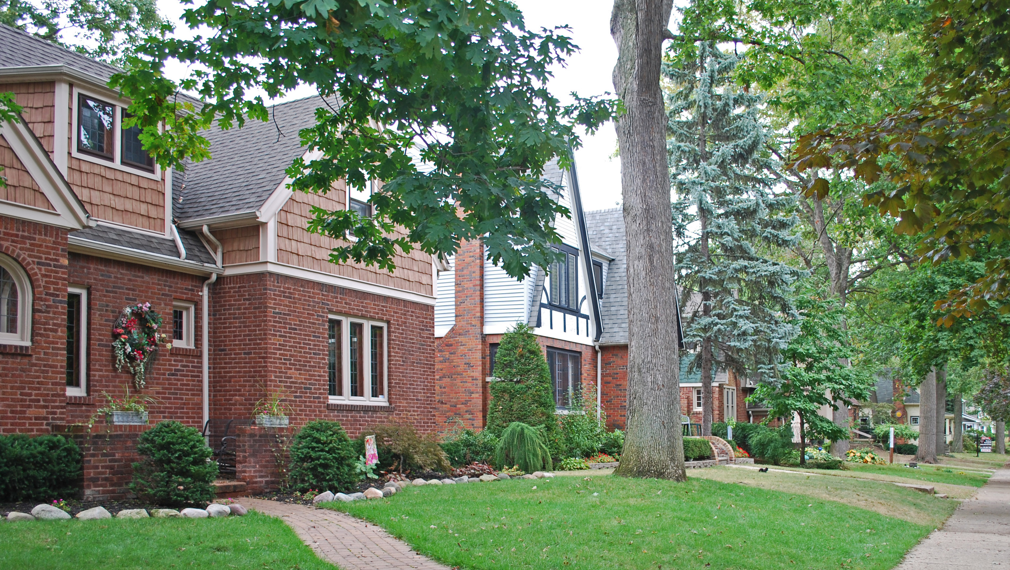 Residential front lawns and brick homes in Pleasant Ridge, near Ferndale, Michigan